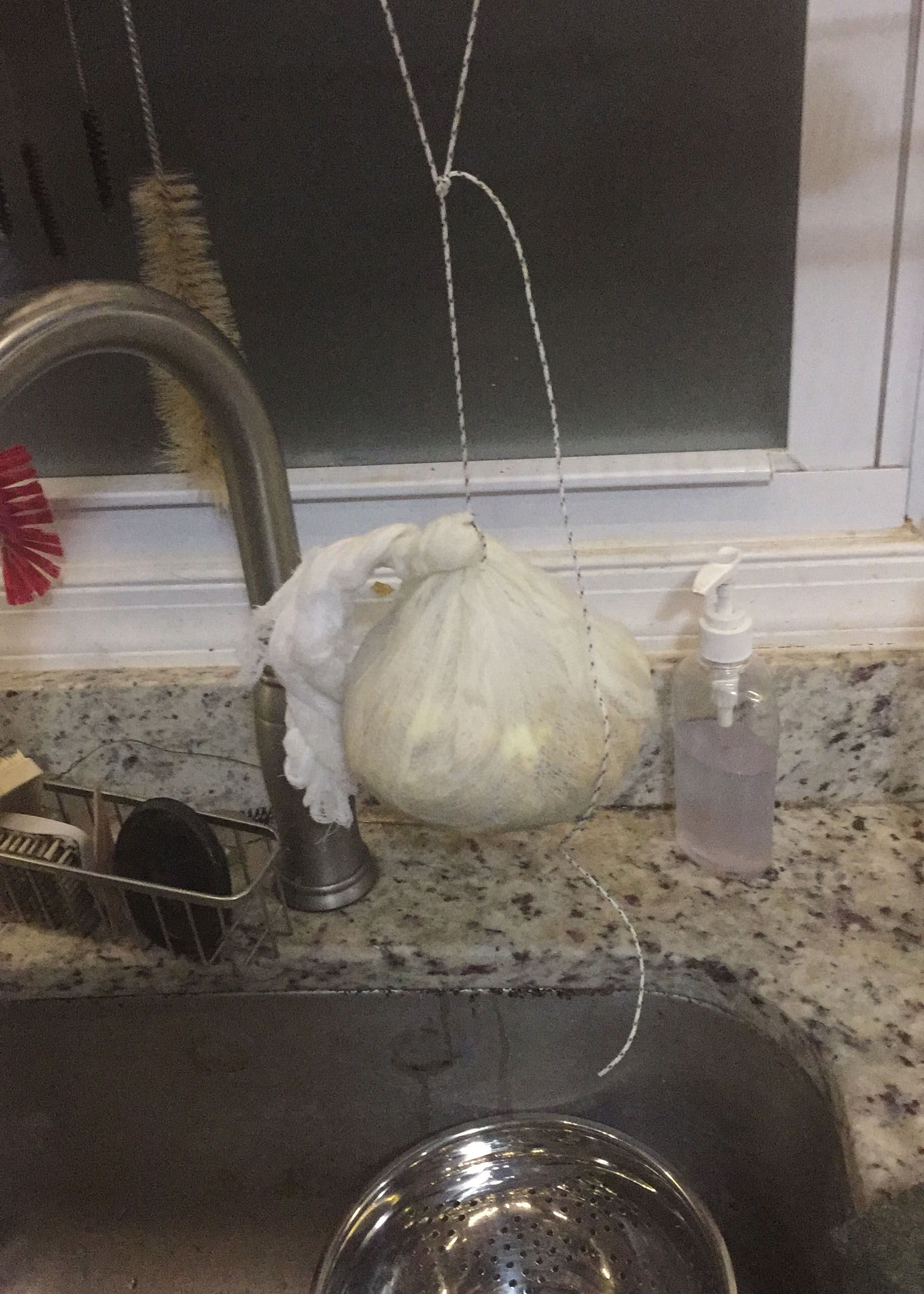 a cheesecloth-wrapped ball hanging over the sink