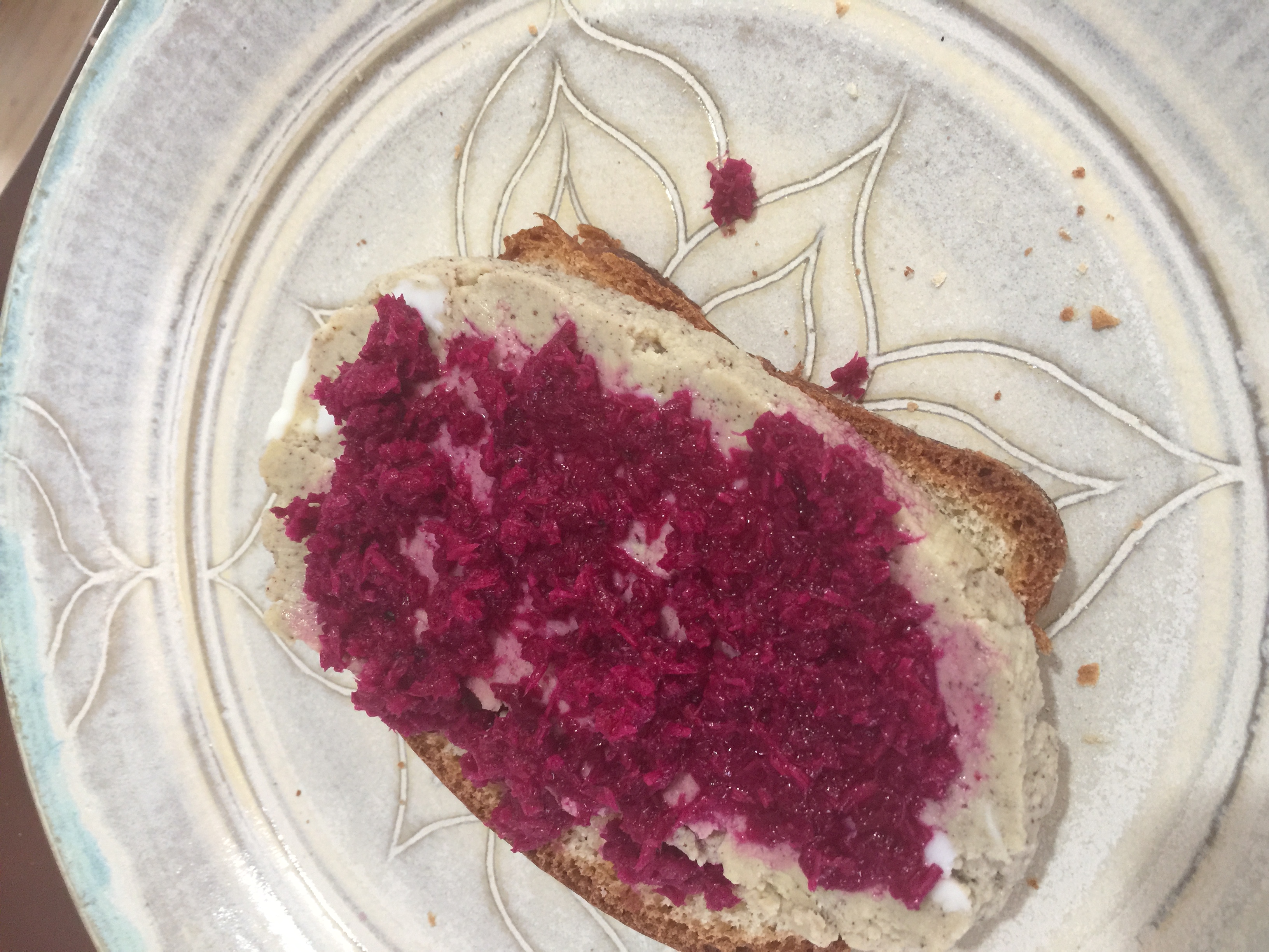 a slice of pascha (bread) with a thick slice of hrudka (a custardy cheese) on top and then chrin (beet horseradish relish) spread on top of that